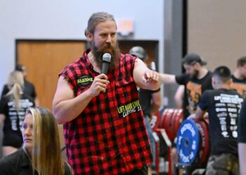 Aberdeen's Tanner Baird of Massenomics Gym addresses the crowd during the 2025 Lift Hard, Live Easy powerlifting competition at the Best Western Ramkota Hotel. This year's event is Friday, July 17 and Saturday, July 18 at the Ramkota. Aberdeen Insider photo by Robb Garofalo.
