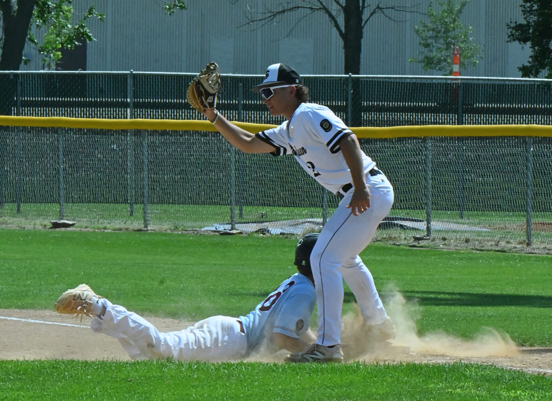 Aberdeen first baseman Michael Dutenhoffer shows the umpire he has the ball as the Smittys complete a double play against Spearfish on Thursday, July 16 at Fossum Field. The Spearfish baserunner is Bray Bowar. Aberdeen swept the doubleheader. Aberdeen Insider photo by Robb Garofalo.