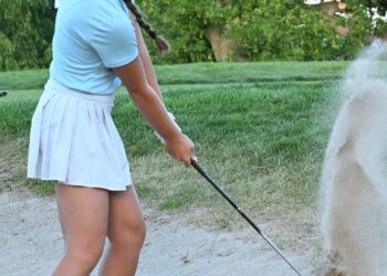Kyley Wirebaugh of Aberdeen chips out of the bunker on the eighth hole during The Derby at The Am presented by Western Saturday, July 18 at Moccasin Creek Country Club. She set the girls course record with a round of 68 on Friday, July 17. Aberdeen Insider photo by Robb Garofalo.
