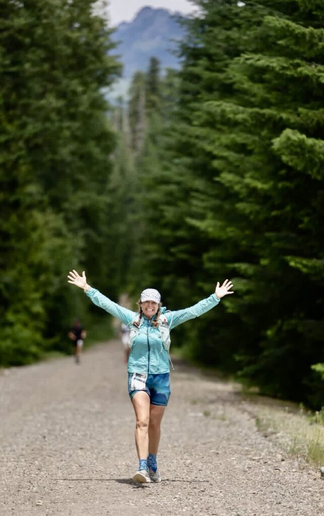 Pamela Monaghan-Geernaert of Aberdeen throws her arms up for a photo during the Yeti Ultra Trail 100-mile race earlier this summer. Courtesy photo.