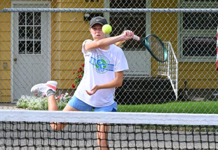 Aberdeen's Penelope Vogel rips a forehand during her singles match in the Hub City Open tennis tournament on Sunday, July 26 at the Northern State courts. Aberdeen Insider photo by Robb Garofalo.