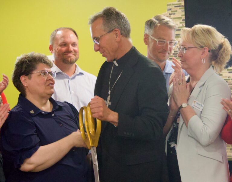 Bishop Donald DeGrood of the Catholic Diocese of Sioux Falls turns to congratulate Sister Roxanne Siefert, councilor and general treasurer for the Presentation Sisters, following the ribbon-cutting for the Presentation Heights Apartments on Tuesday, July 28. Aberdeen Insider photo by Elisa Sand.