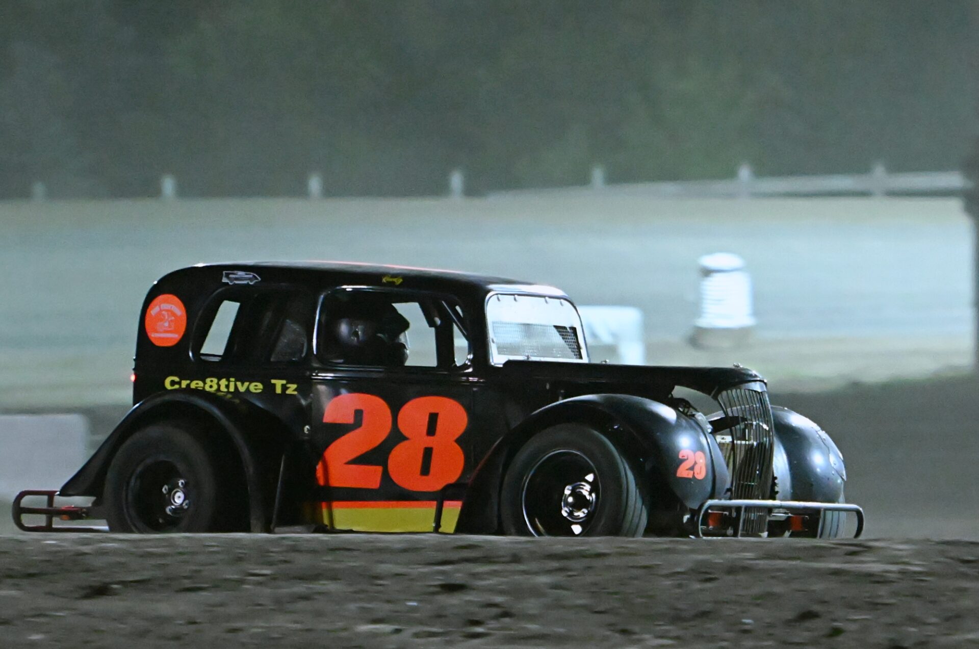 Dusty Mund of Lisbon, N.D., heads down the back straightaway in the INEX Legends feature race during Kids Night Friday, July 31 at Brown County Speedway. Mund claimed  his third checkered flag of the season in Aberdeen. Aberdeen Insider photo by Robb Garofalo.