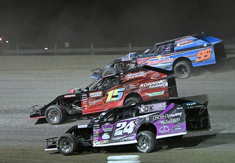 Ryan Ost (24), Taylor Schmidt (15) and James Irwin race three wide during the Midwest Modifieds feature on Friday, July 31 at Brown County Speedway. Todd Stark won the race. Aberdeen Insider photo by Robb Garofalo.