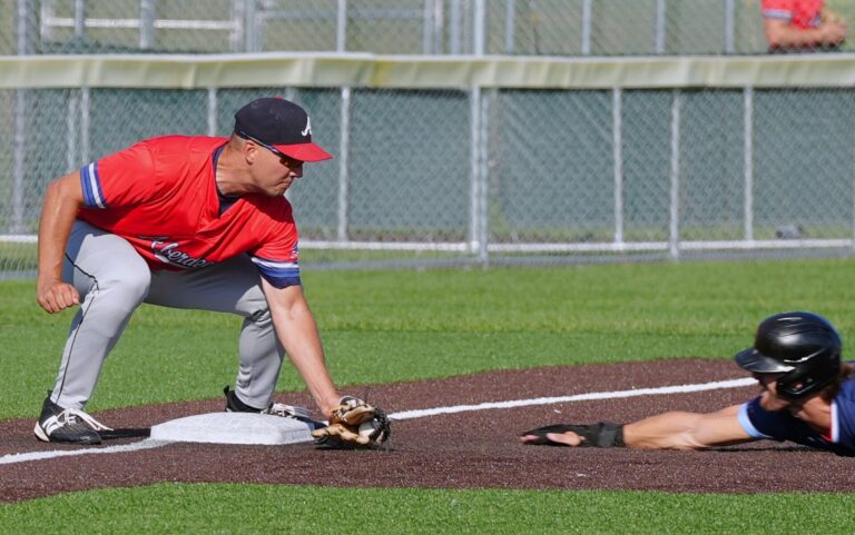 Aberdeen third baseman Kris Kwak waits to apply the tag to Brookings' Rhett Zelinsky on a stolen base attempt during a Class A district amateur baseball game on Saturday, Aug. 1 in Brookings. Zelinsky was out, but the Cubs won 15-3. Photo by Kevin Foss for the Aberdeen Insider.