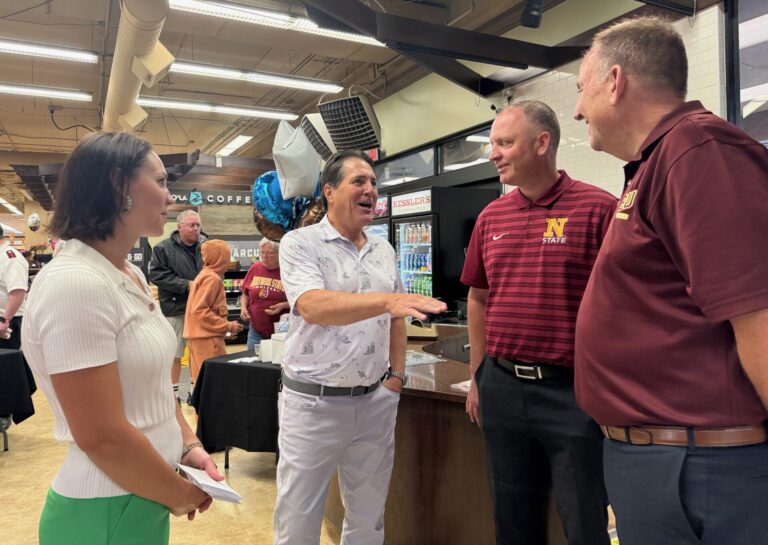 Coborn President Emily Coborn Wright, left, and CEO Chris Coborn visit with Northern State University Director of Athletics Nate Davis and NSU President Alan LaFave on Thursday, July 30 at Kessler's. Aberdeen Insider photo by Elisa Sand.