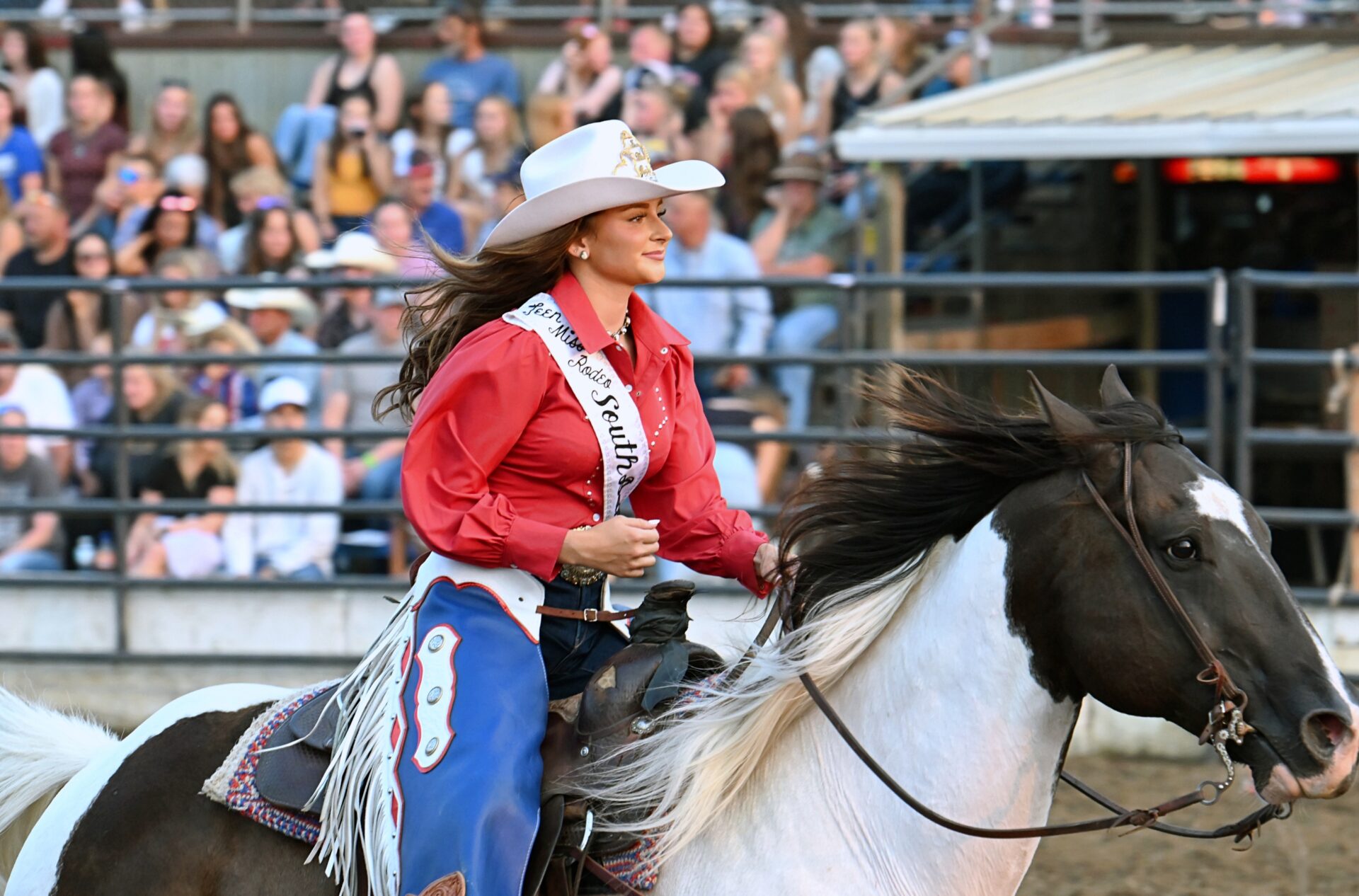 Groton's Taryn Thompson, 2026 Miss Teen Miss Rodeo South Dakota, rides into the arena during the Dacotah Bank Stampede rodeo Monday, Aug. 10 on opening night of the Brown County Fair. Aberdeen Insider photo by Robb Garofalo.