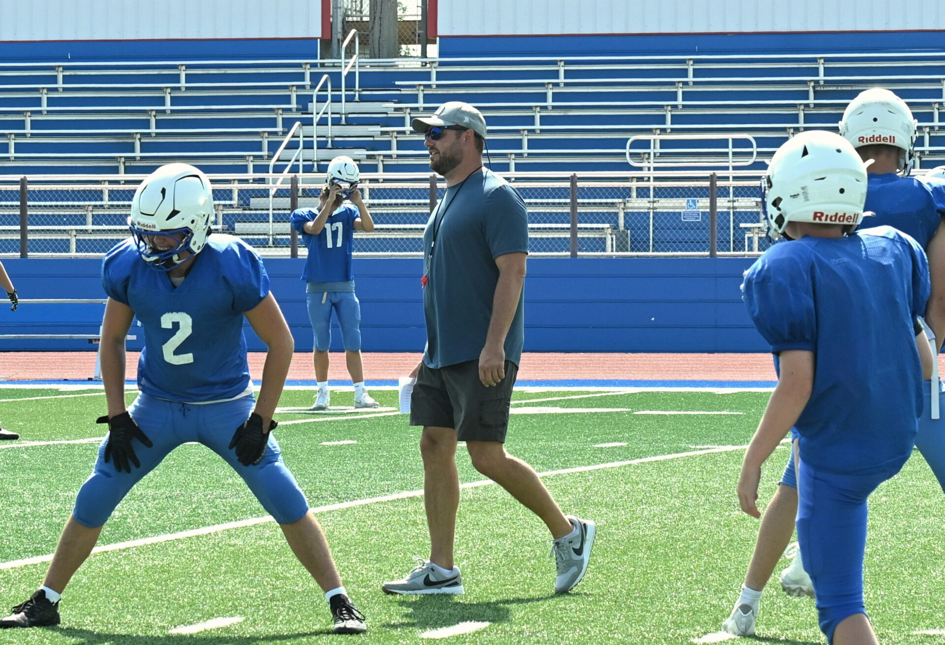 Warner head football coach Derek Hoellein watches his team stretch before practice on Monday, Aug. 17 at BankNorth/Dial-A-Move Field in Warner. The Monarchs open their season Friday, Aug. 21 against Northwestern in Mellette. Aberdeen Insider photo by Robb Garofalo.