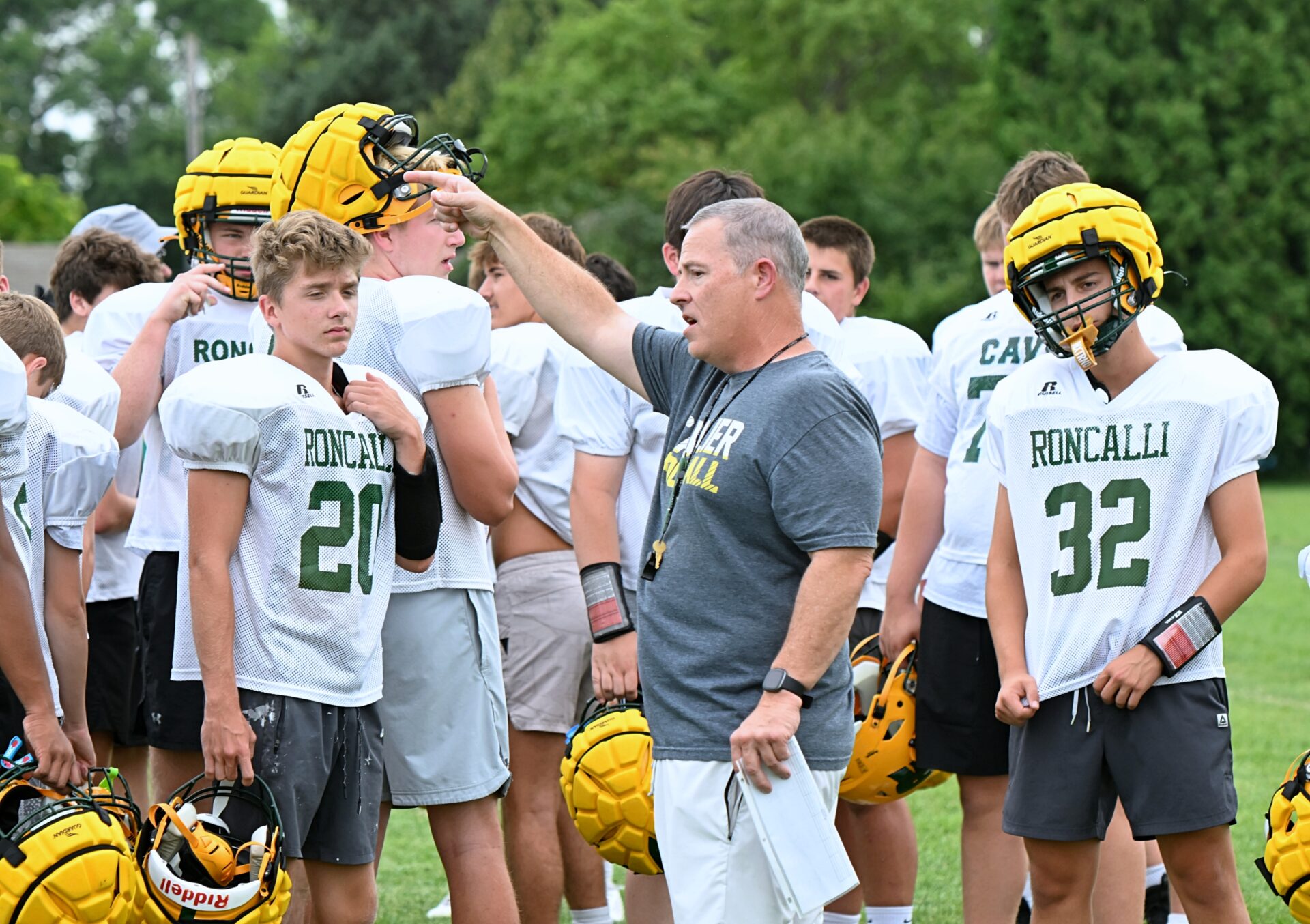 Aberdeen Roncalli head football coach Billy Young gets practice started Monday, Aug. 17 at Roncalli High School. Young begins his 10th season as head coach on Friday, Aug. 21 against Sioux Valley in Volga. Aberdeen Insider photo by Robb Garofalo.