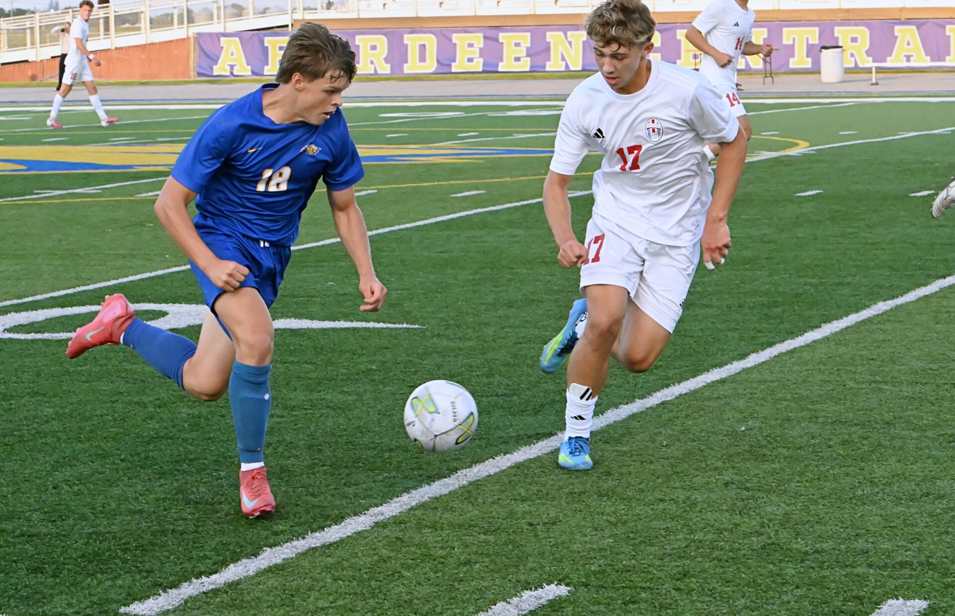 Aberdeen Central's Brook Bonn, left, and Sioux Falls Lincoln's Berhart Rheins pursue the ball during the first half of Central's 1-0 win Friday, Aug. 21 at Brownell Activities Complex. Aberdeen Insider photo by Robb Garofalo.