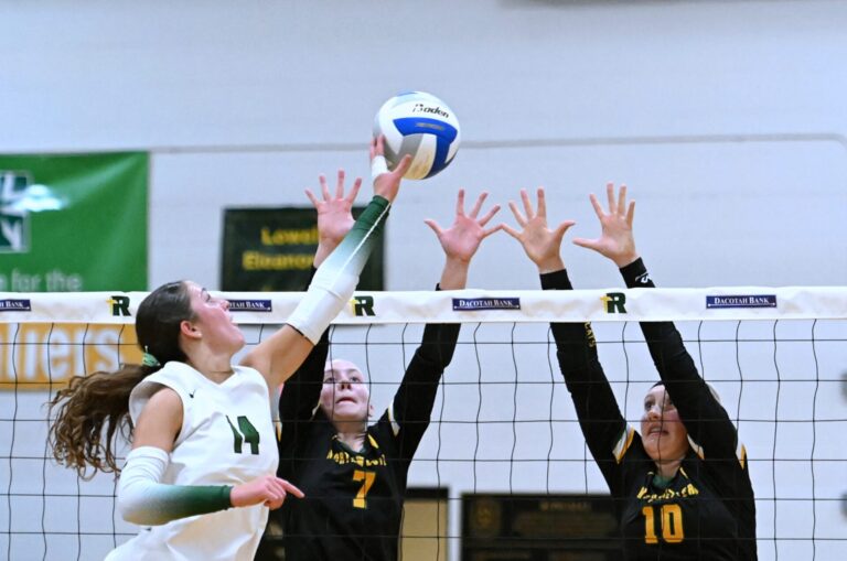 Roncalli picks up rare volleyball victory against Northwestern 8 Aberdeen Roncalli's Grace Cogley tries to hit through the block attempt by Northwestern's Lila Johnson, left, and Kylee Henjum Tuesday, Aug. 25 at the Roncalli Gym. Cogley had 16 kills in a four-set victory. Aberdeen Insider photo by Robb Garofalo.