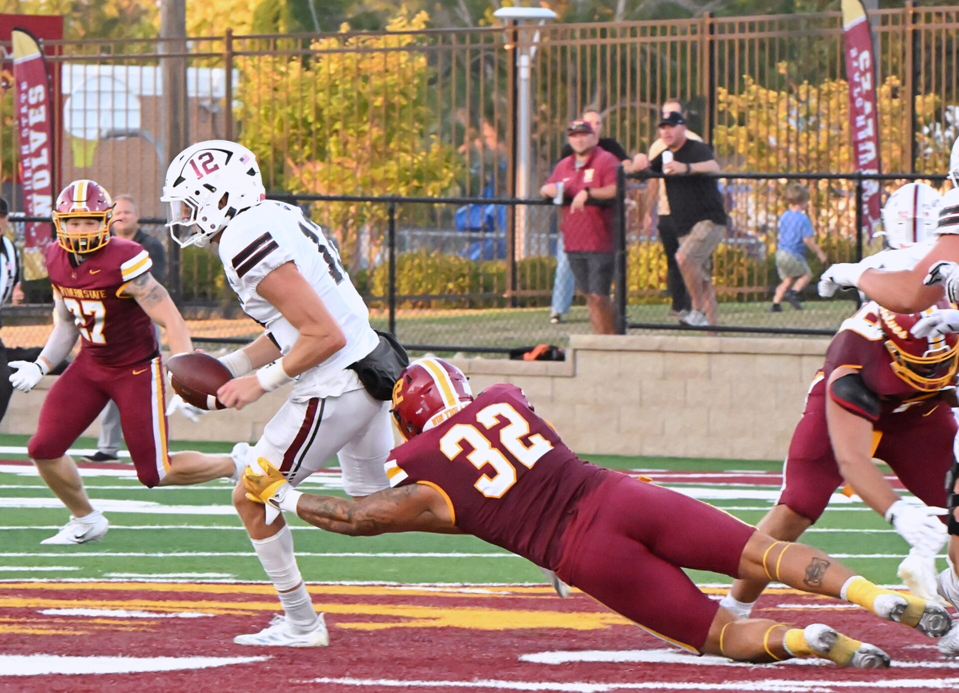 Northern State's Gabe Gutierrez dives to make the tackle on Chadron State quarterback Aidan Thompson during the third quarter of the Wolves 42-17 victory Thursday, Aug. 27 at Dacotah Bank Stadium. Aberdeen Insider photo by Robb Garofalo.