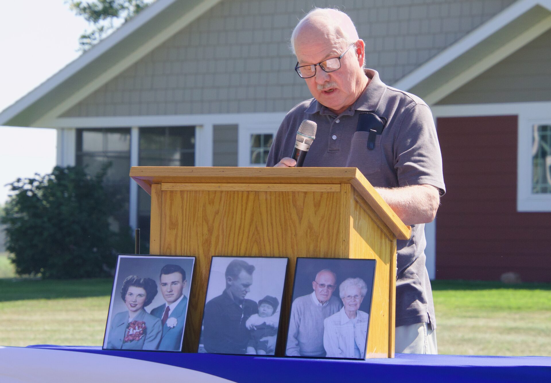 Terry Ellingson speaks during the Thursday, Aug. 27 groundbreaking for two new twin homes Aspire is building in Aberdeen. His mother and step-father made donations to the project. Aberdeen Insider photo by Elisa Sand.