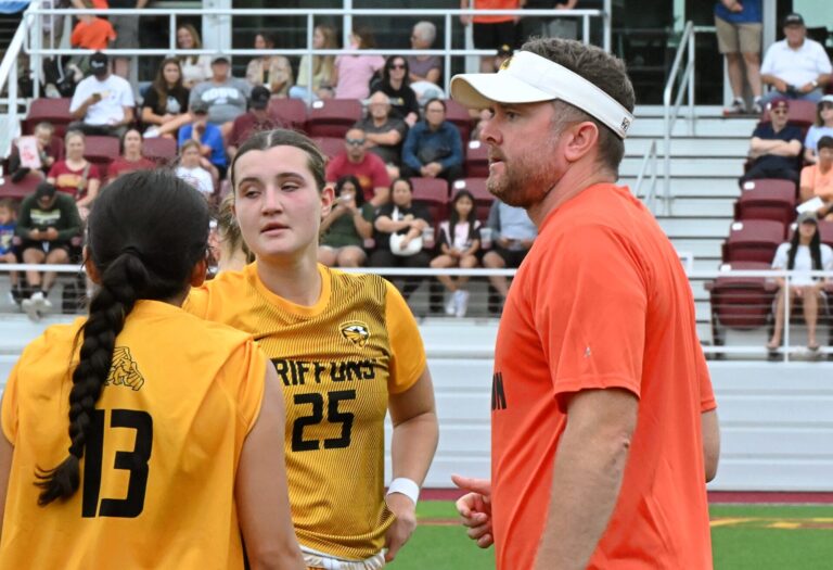 Western Missouri head women's coach Jacob Plocher talks with Magaly Lopez (13) and Cara Jeffries during a stoppage in the first half of the Griffons match against Northern State Sunday, Aug. 30 at the Northern Athletic and Recreation Fields. The former Presentation College coach guided his current team to a 3-2 win. Aberdeen Insider photo by Robb Garofalo.