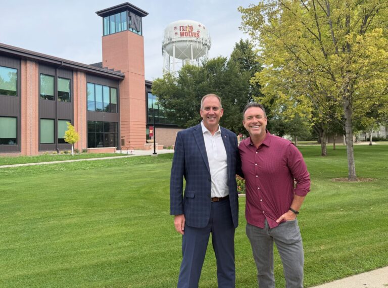 Northern State University President Alan LaFave, left, stands with Alex Boylan, host of "The College Tour." An upcoming episode of the program will feature the Aberdeen campus. Aberdeen Insider photo by Elisa Sand.