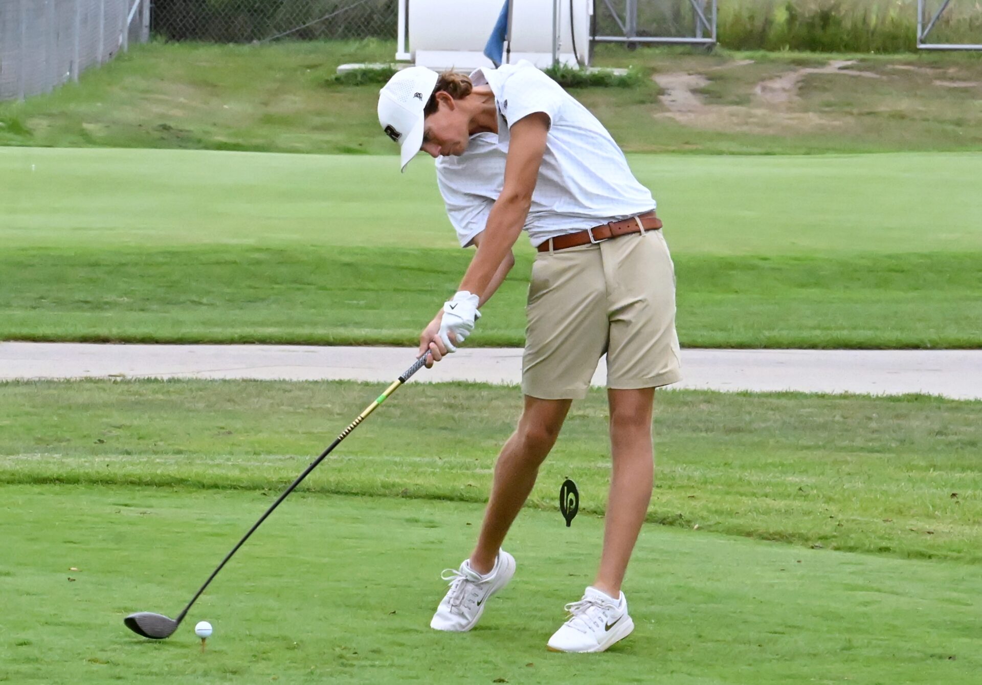 Aberdeen Roncalli's Harper Schnabel leans into his tee shot on the par-four 10th hole during the Hub City Invitational Tuesday, Sept. 1 at Lee Park Golf Course. Schnabel earned medalist honors after his three-under 68. Aberdeen Insider photo by Robb Garofalo.