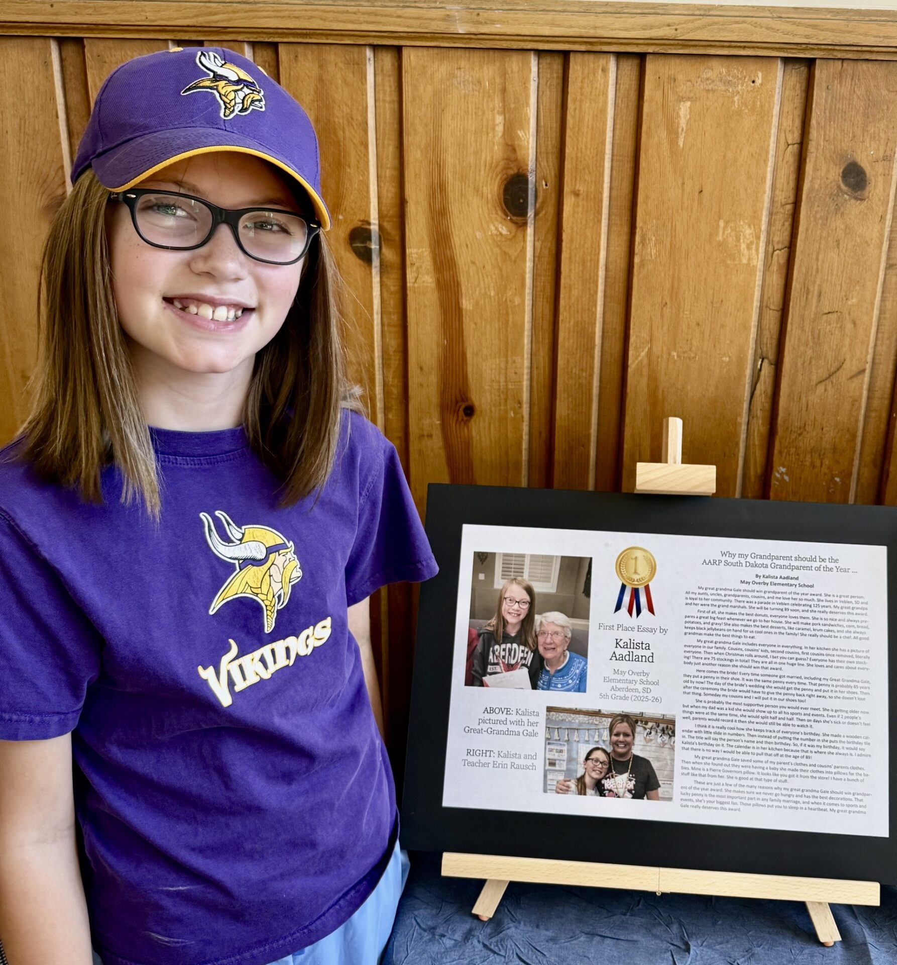 Kalista Aadland, a sixth-grader at Simmons Middle School, at the Dacotah Prairie Museum with her winning essay about her great-grandmother. She placed first in the state in the Retired School Personnel Grandparent Essay Contest. Courtesy photo.