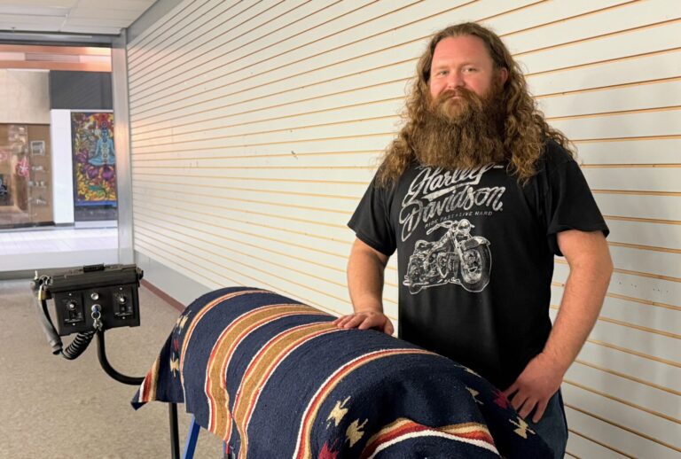 Josh Dennert uses a robotic horse to simulate horseback therapy at Midwest Mind and Body Center at Uptown Aberdeen. Aberdeen Insider photo by Elisa Sand.
