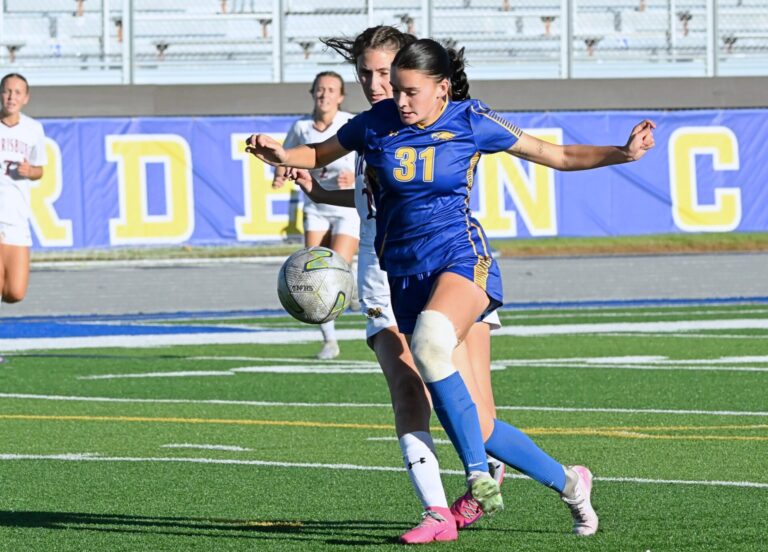 Aberdeen Central's Brianna Fischer beats Harrisburg's Sidney DeJong to the ball in the first half of the Eagles loss Tuesday, Sept. 8 at the Brownell Activities Complex. Aberdeen Insider photo by Robb Garofalo.