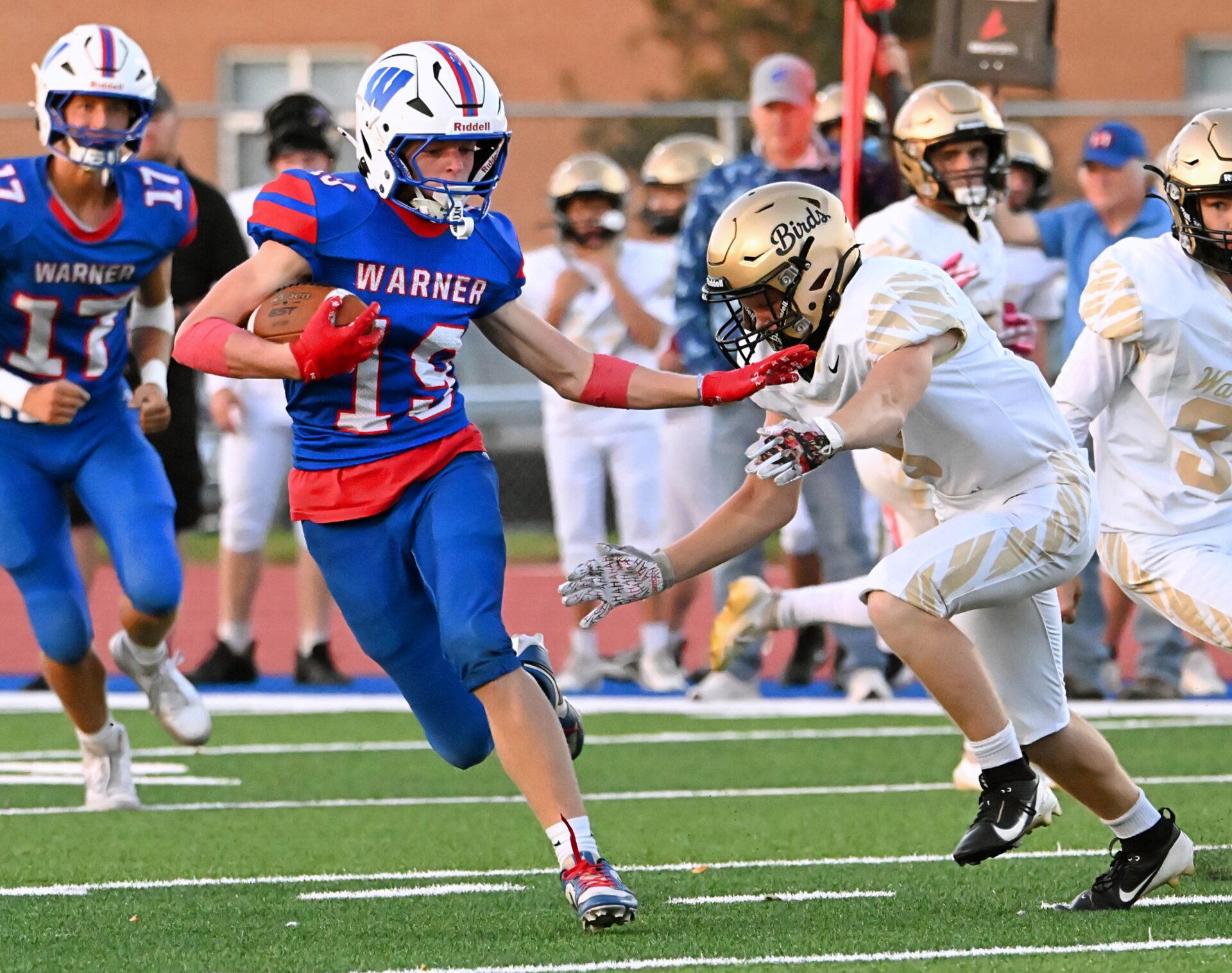 Warner's Beckham Cantalope sheds a tackle attempt by Wolsey-Wessington's Cooper Timm en route to a 32-yard first-quarter touchdown Friday, Sept. 11 at BankNorth/Dial-A-Move Field. Warner improved to 4-0 with a 51-27 win. Aberdeen Insider photo by Robb Garofalo.