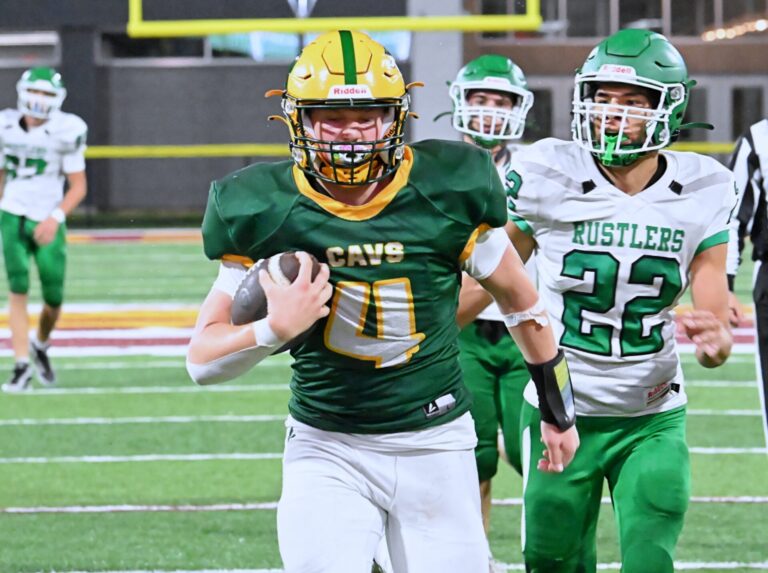 Aberdeen Roncalli's Brock Bowman outraces Miller/Highmore-Harrold's Kia McCauley to the end zone on a 22-yard touchdown reception Friday, Sept. 18 at Dacotah Bank Stadium. Bowman scored twice in a 39-0 shutout. Aberdeen Insider photo by Robb Garofalo.
