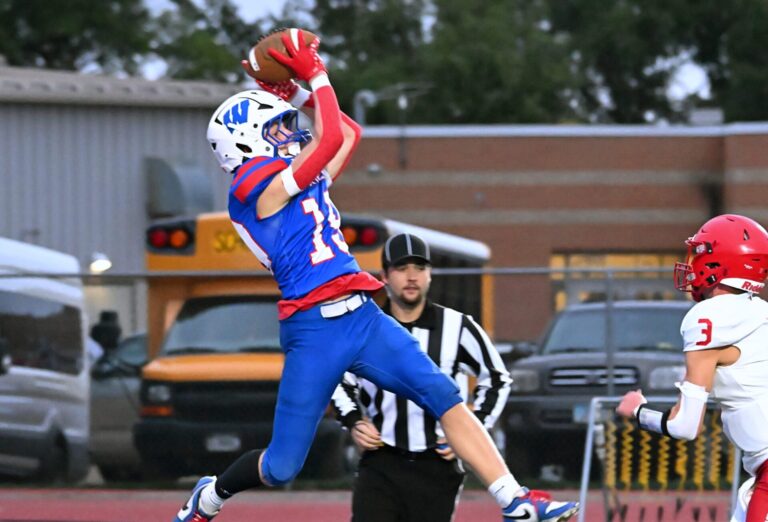 Warner's Beckham Cantalope makes a leaping catch in the end zone for a first-quarter touchdown during Warner's 17-6 victory over Hitchcock-Tulare Friday, Sept. 25 at BankNorth/Dial-A-Move Field in Warner. Aberdeen Insider photo by Robb Garofalo.