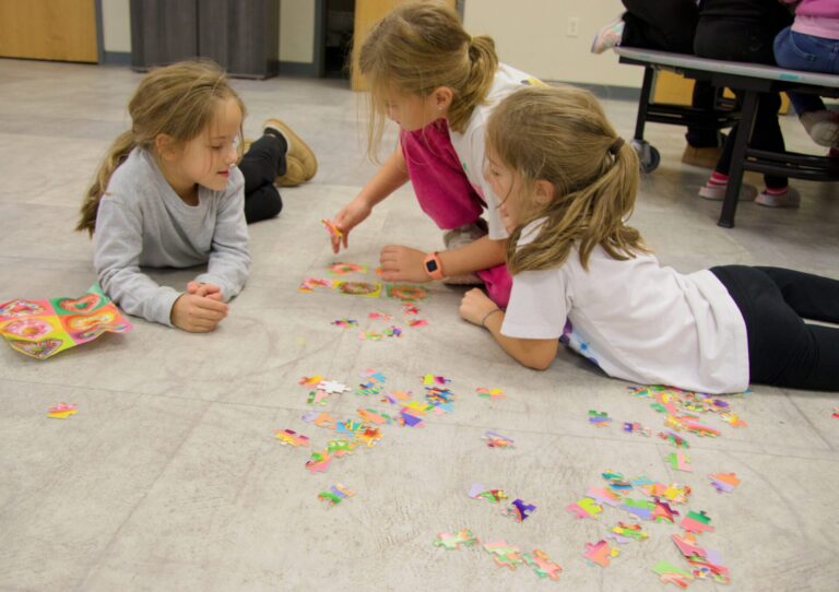 Aberdeen youth, from left, Sawyer Nichols, Viola Barnett and Addison Nichols put together a puzzle after school at the Glenna and Rodney Fouberg Youth Development Center. The puzzle-assembly activity was one of several activities for youth in the after school program. Aberdeen Insider photo by Elisa Sand.