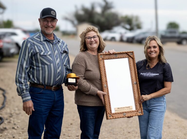 At the Field to Fork event in Aberdeen, Diann and Brad Morehouse received a special mirror to honor them as 2026 Farm Family of the Year. Shown with them is Gail Ochs of the Aberdeen Area Chamber of Commerce. Courtesy photo.