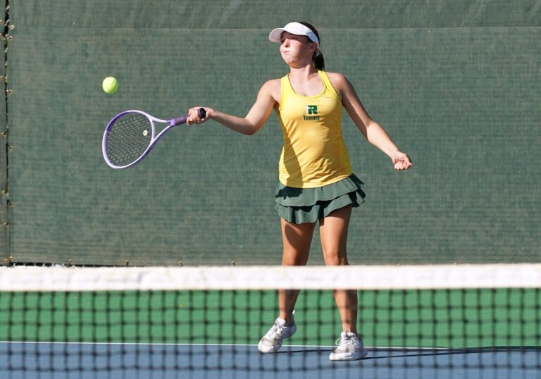 Aberdeen Roncalli's Abigail Andersen hits a forehand during the Class A state girls tennis tournament Tuesday, Oct. 6 in Rapid City. Andersen took second at fifth-flight singles, helping the Cavaliers tie for fourth place. Photo courtesy of South Dakota Public Broadcasting.
