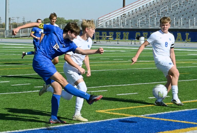 Aberdeen Central's Linus Johnson scores a first-half goal against Rapid City Stevens during the Class AA boys high school soccer quarterfinals Saturday, Oct. 10 at Brownell Activities Complex. Defending for Stevens is Colton Kuyper, middle, and Carson Pressley. The Raiders won 3-1. Aberdeen Insider photo by Robb Garofalo.