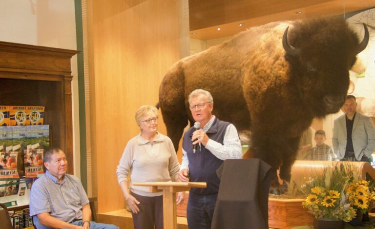 Ray and Cyndy Larson speak about their Ray and Cyndy Larson speak about their connection to Dean Buntrock's family and Buntrock's philanthropy on Saturday, Oct. 10 during a ceremony unveiling a full buffalo display at the Dacotah Prairie Museum. At left is Ron Brownotter, who manages a buffalo herd on the Standing Rock Indian Reservation. Buntrock died earlier this year, but was a benefactor of the museum, including its ability to add the bison. Aberdeen Insider photo by Elisa Sand.connection to Dean Buntrock's family and Buntrock's philanthropy on Saturday, Oct. 10 during a ceremony unveiling the full buffalo on display at the Dacotah Prairies Museum. At left is Ron Brownotter, who manages a buffalo herd on the Standing Rock Indian Reservation. Buntrock died earlier this year, but was a benefactor of the museum, including its ability to add the bison. Aberdeen Insider photo by Elisa Sand.