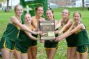 The Aberdeen Roncalli girls cross-country team celebrates its Region 1A team championship Wednesday, Oct. 14 at the Webster Golf Club. From left are Norah Gonsor, Bailey Nold, Addison Cassady, Hazel Kannegieter, Taylor McComsey and Hannah Eskro. Aberdeen Insider photo by Robb Garofalo.