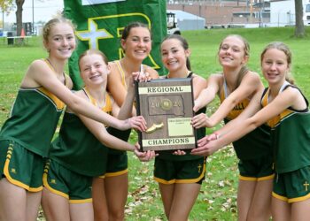The Aberdeen Roncalli girls cross-country team celebrates its Region 1A team championship Wednesday, Oct. 14 at the Webster Golf Club. From left are Norah Gonsor, Bailey Nold, Addison Cassady, Hazel Kannegieter, Taylor McComsey and Hannah Eskro. Aberdeen Insider photo by Robb Garofalo.