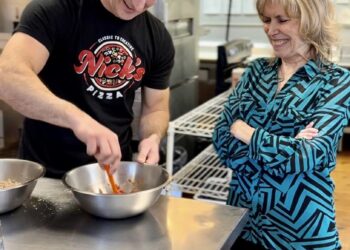 Nick Schaunaman, left, owner of Nick's Pizza, works with Loretta McLaughlin to recreate the flavor of a Lu's pie. Nick's will be selling two pizzas formerly offered by Lu's during a two-week collaboration. Courtesy photo.